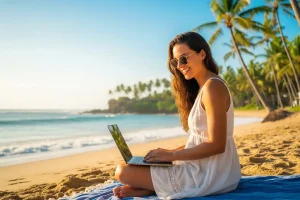 Digital nomad working on laptop by the beach