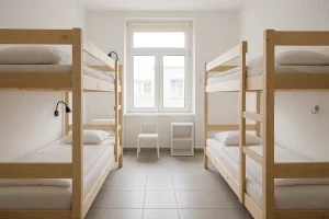 A clean, minimalist hostel dorm room, symbolizing a comfortable and hygienic place to stay on a budget.
