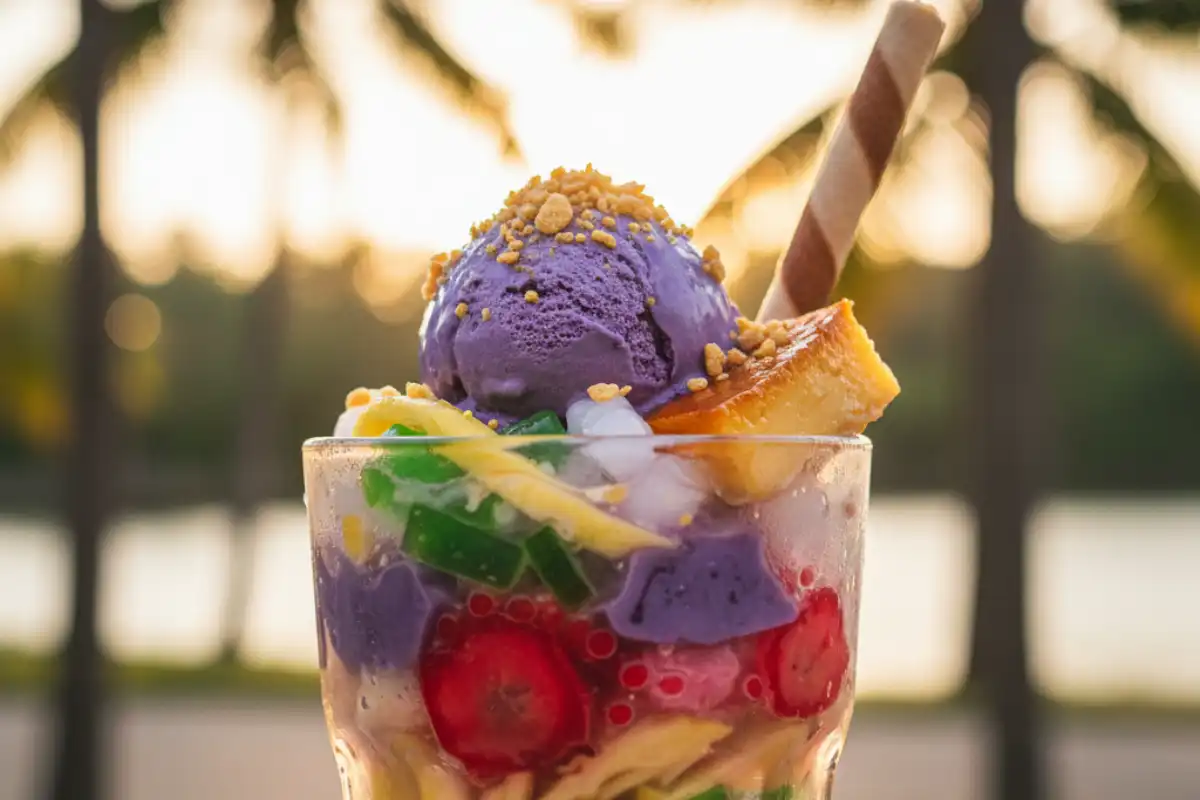 A cup of colorful Filipino dessert Halo-Halo with ice cream and mixed sweets.