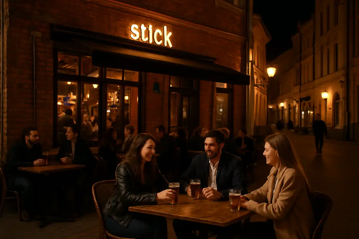 A lively bar scene in Minsk Old Town at night with people relaxing.
