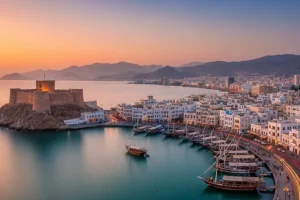The Mutrah Corniche and Fort in Muscat with traditional buildings and the sea.