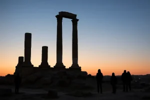 The Roman Temple of Hercules ruins silhouetted against the sky on the Amman Citadel.