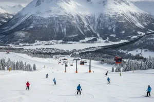 The rugged, high-alpine peaks of Hemsedal, Norway, with wide ski slopes leading down into the valley and a modern lift system.