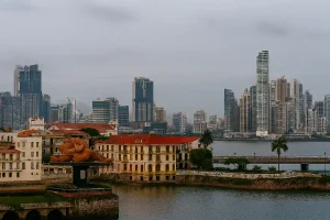 View of Panama City's modern skyscrapers towering over the historic Casco Viejo district.