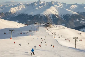 Panoramic view of the Gudauri ski resort with wide, open slopes high above the tree line in the Caucasus mountains.