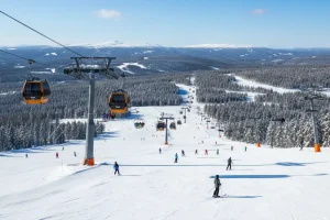 Wide, snow-covered slopes at Hafjell, one of the main ski areas in the Lillehammer region, with modern lifts and a clear day.