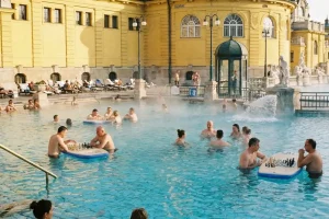The yellow Neo-Baroque outdoor pools of Szechenyi Thermal Bath in Budapest.