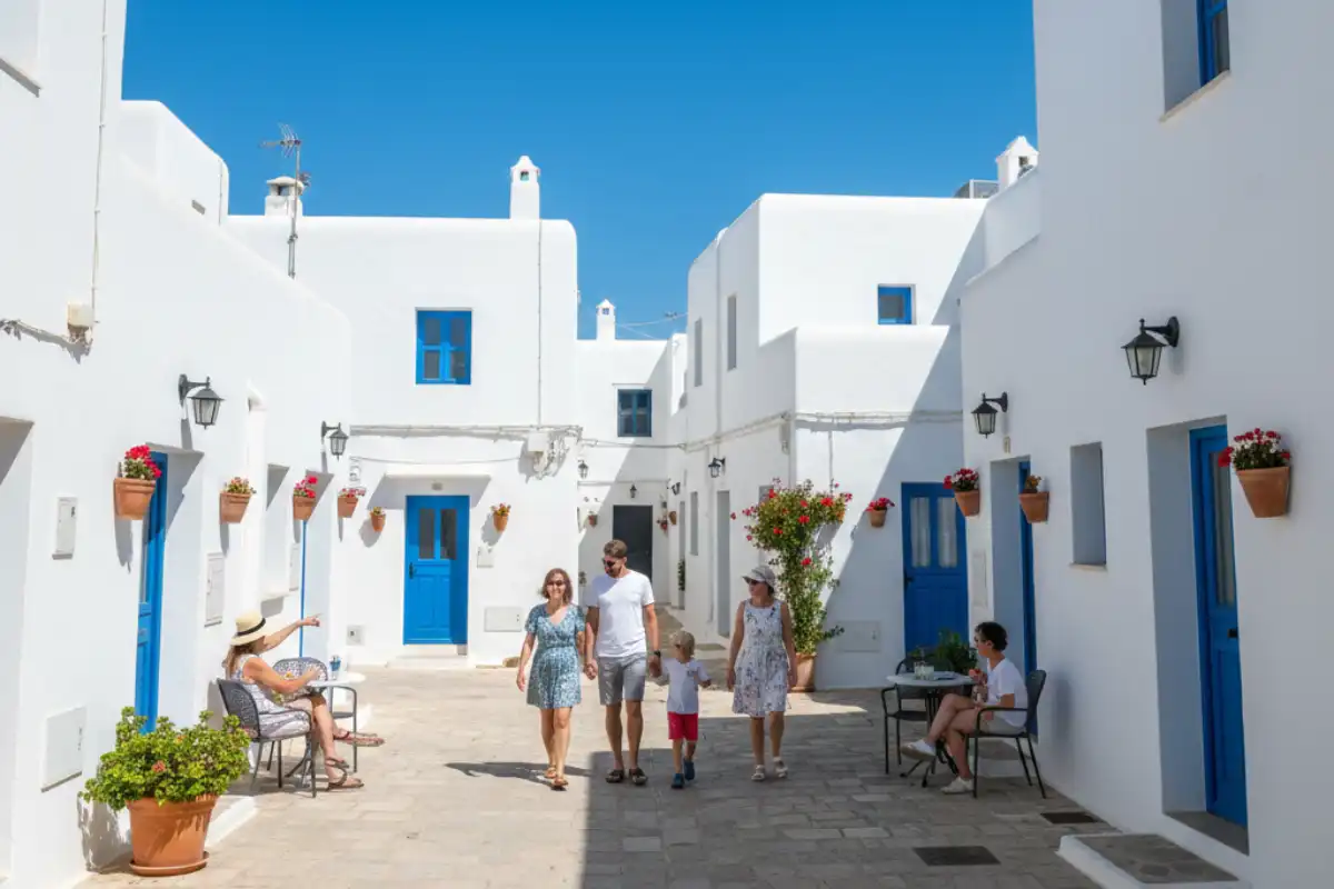 The perfectly uniform white-washed houses of Binibeca Vell creating a striking contrast against the deep blue Mediterranean sky