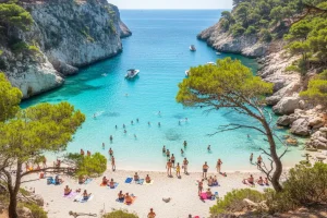 The translucent turquoise waters of Cala Macarella framed by white limestone cliffs and a dense canopy of Mediterranean pine trees